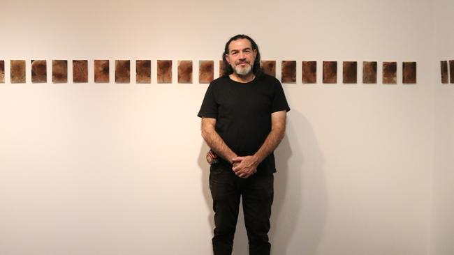 Khaled Sabsabi with his works at Mosman Art Gallery.