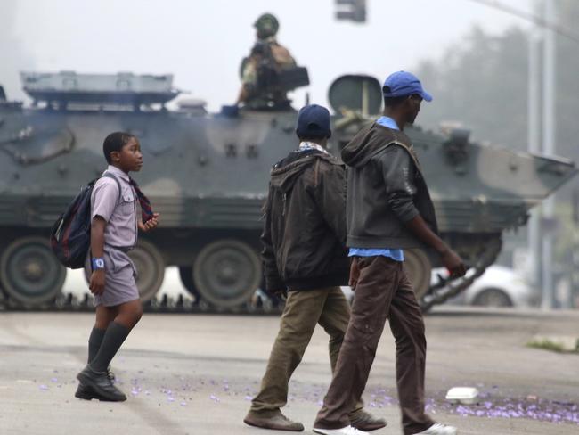 An armed soldier patrols a street in Harare after the country’s military took control. Picture: AP