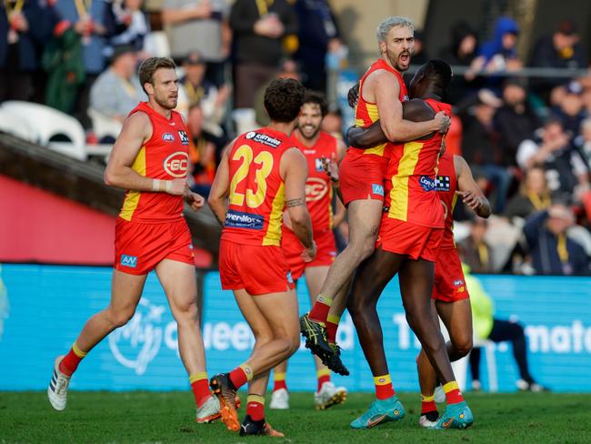 Izak Rankine of the Suns celebrates a goal during the 2022 AFL Round 22 match between the Gold Coast Suns and the Geelong Cats at Metricon Stadium. Picture: Russell Freeman/AFL Photos via Getty Images)