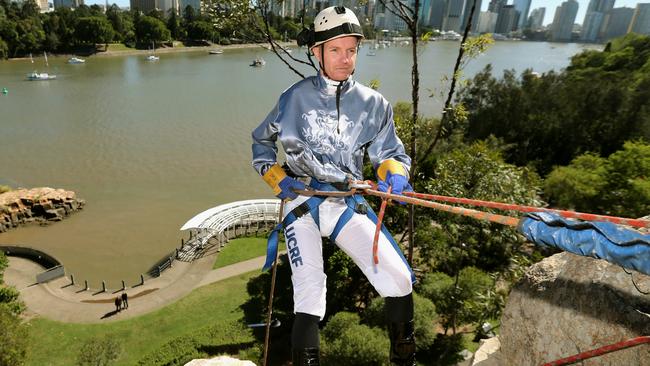 Ryan Wiggins abseils down Kangaroo Point.