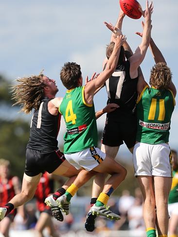 Gippsland Football League Grand Final match between Maffra Eagles and Leongatha Parrots. Maffra became the 2016 premiers, defeating Leongatha 13.10 (88) to 9. 16 (67). Danny Butcher and Michael Coleman take on Leongatha’s Josh Hopkins and Jason Tomada in a marking contest. Picture: Yuri Kouzmin