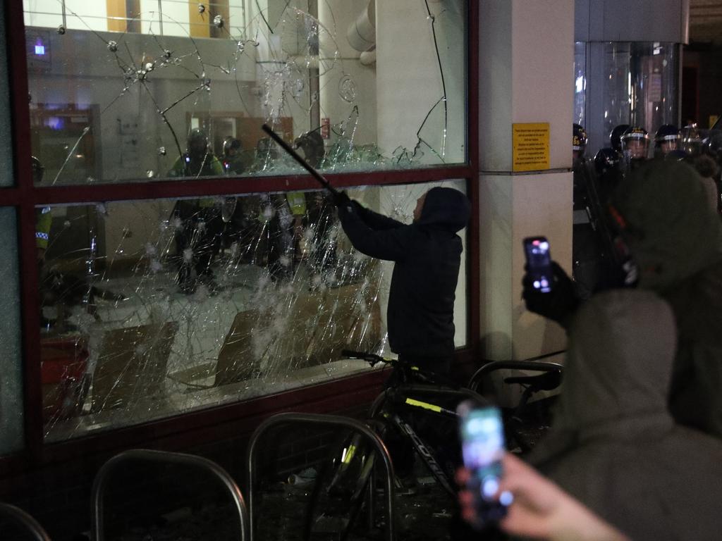 Protesters smash windows at Bridewell Station. Picture: Andrew Matthews/PA Wire /AAP