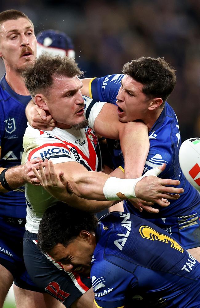 SYDNEY, AUSTRALIA – JUNE 15: Angus Crichton of the Roosters is tackled by the Eels defence during the round 15 NRL match between Parramatta Eels and Sydney Roosters at CommBank Stadium, on June 15, 2024, in Sydney, Australia. (Photo by Brendon Thorne/Getty Images)