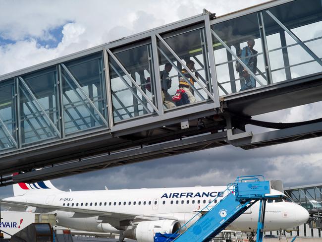 Passengers at Charles-de-Gaulle Airport, in Roissy-en-France. Picture: AFP