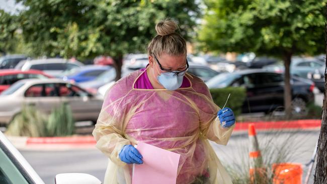 A nurse holds a nasal swab after testing a patient for coronavirus at a COVID-19 testing centre in Austin, Texas. Picture: Getty Images