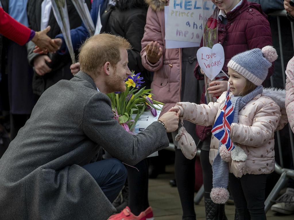 Prince Harry chatted with youngsters in the crowd. Picture: Charlotte Graham/AP