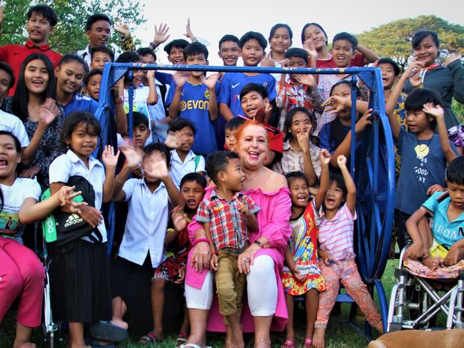 In a picture taken in February of 2023, Geraldine Cox is photographed with children who live at the home she runs in Cambodia. The home is a place for children who have been abandoned by their parents or removed from families to live.