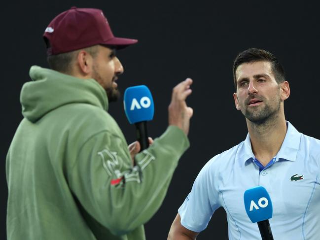 MELBOURNE, AUSTRALIA - JANUARY 23: Novak Djokovic of Serbia is interviewed by Nick Kyrgios after their quarterfinals singles match against Taylor Fritz of the United States during the 2024 Australian Open at Melbourne Park on January 23, 2024 in Melbourne, Australia. (Photo by Daniel Pockett/Getty Images)