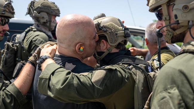 Shlomi Zi kisses a soldier after his rescue from the Gaza Strip by the Israeli army. Picture: Israel army/AFP.