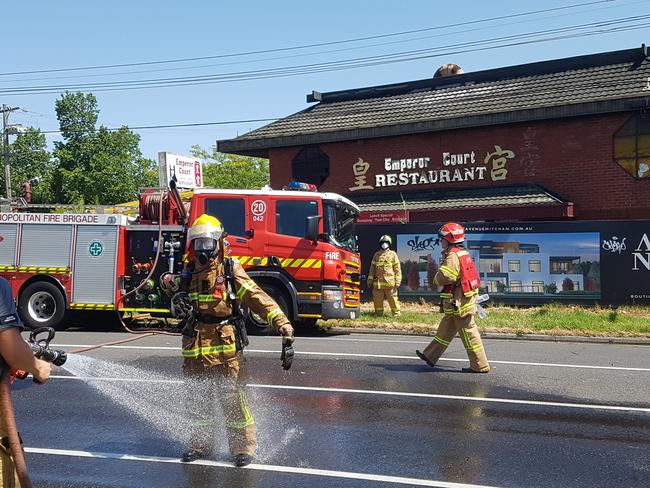 Firefighters extinguish a blaze at the former Emperors Court Chinese restaurant in Mitcham.