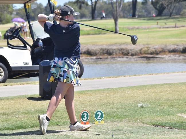 Lily McGuiness tees off in one of her many tournaments.