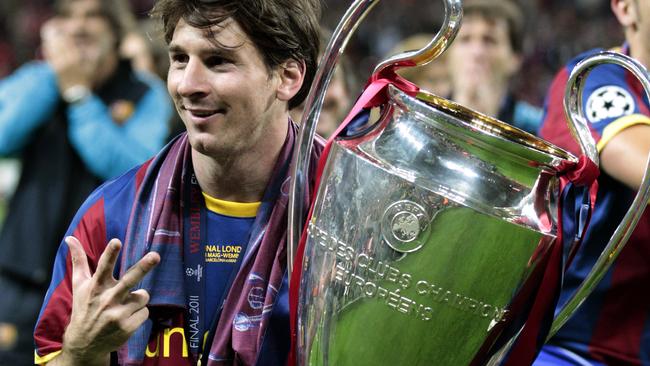 Barcelona's Lionel Messi celebrates a third Champions League victory, at Wembley Stadium.