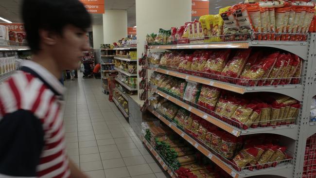 A man passes a counter with imported pasta at a supermarket in downtown Moscow yesterday. Picture: Ivan Sekretarev