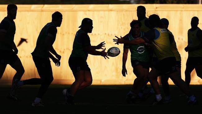 Supr Rugby leaders the Waratahs train under the setting sun without injured captain Dave Dennis.