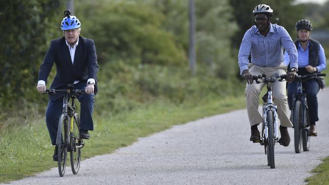 Boris Johnson, left with Darren Henry the Conservative MP for Broxtowe, in Beeston near Nottingham, England, to launch the cycling intuitive to help get people fitter. Picture: Getty Images