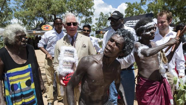 Prince Charles, the Prince of Wales, is led away following a Welcome to Country Ceremony at Mt Nhulun in Gove, Arnhem Land, Australia, Monday, April 9, 2018. The Prince of Wales and Duchess of Cornwall are on a seven-day tour of Australia, visiting Queensland and the Northern Territory. (AAP Image/Getty Images Pool, Brook Mitchell) NO ARCHIVING