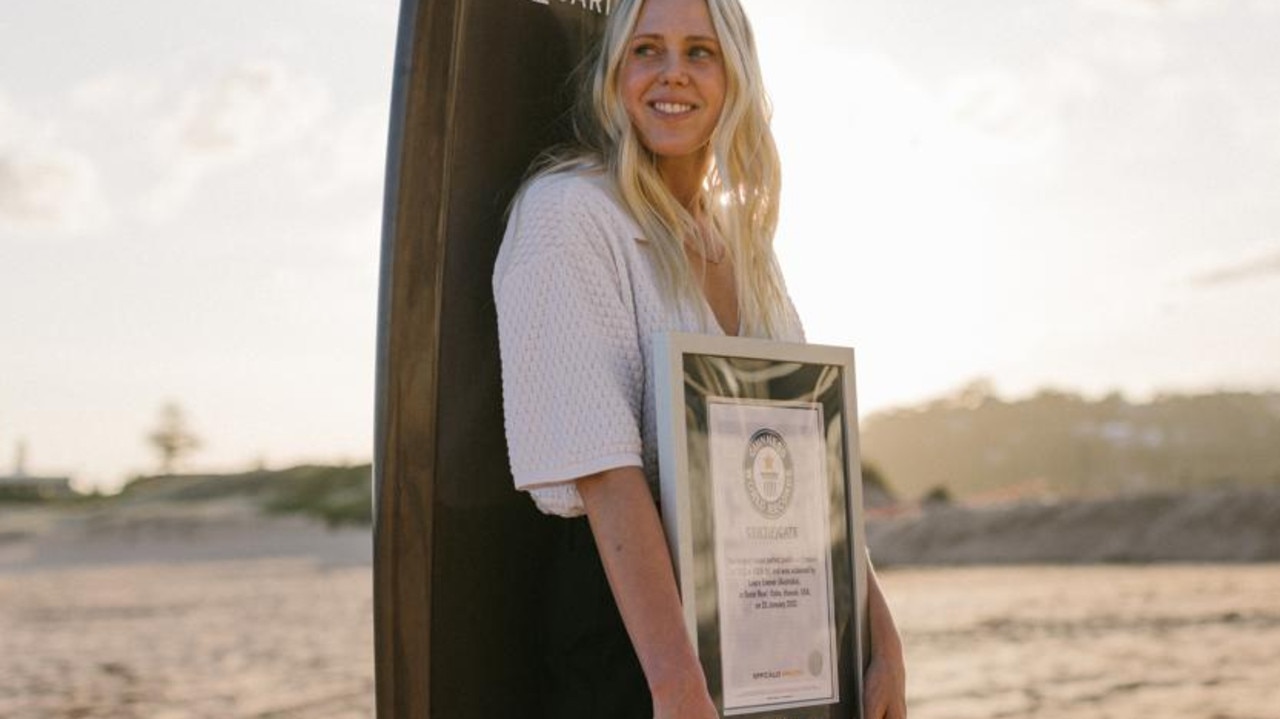 Laura Enever accepts the official Guinness World Record certificate for largest wave surfed paddle-in (female). Picture: Matt Dunbar/World Surf League