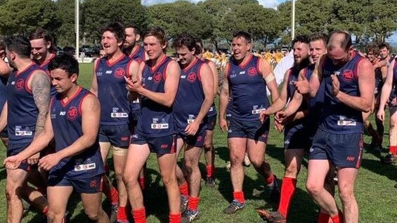 Freeling's reserves side leaves the ground and applauds fans after their historic win over Willaston. Picture: Freeling Football Club