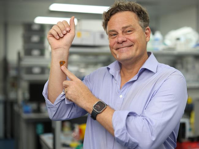 Professor Mark Kendall, Founder and CEO of WearOptimo, demonstrates a prototype of the adhesive that would gauge dehydration in the wearer. Picture: Supplied