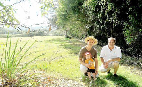 Adam Curlis, his son, Lenny, and David Wilson at the Englands Park site earmarked for Coffs Harbour’s community garden.