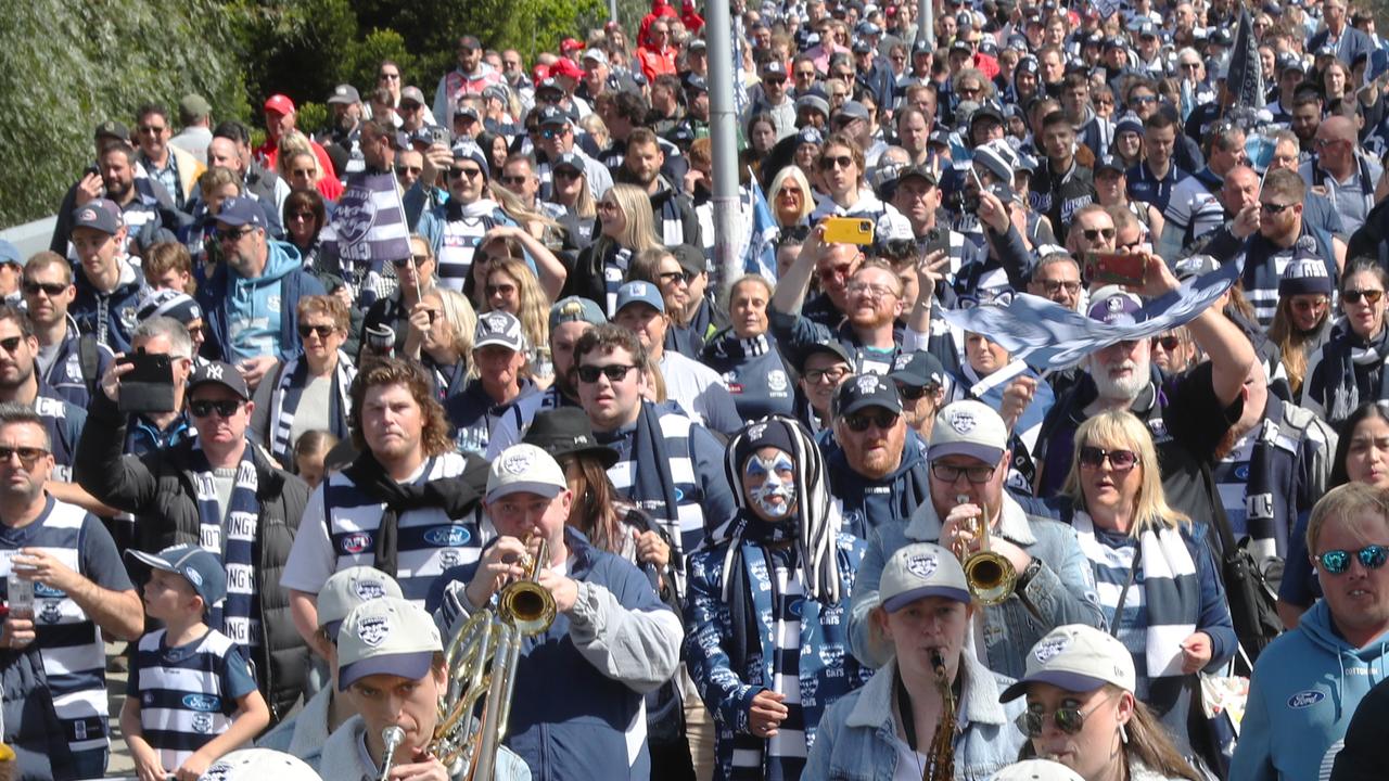 Geelong fans, along with a band, head to the MCG. Picture: NCA NewsWire / David Crosling