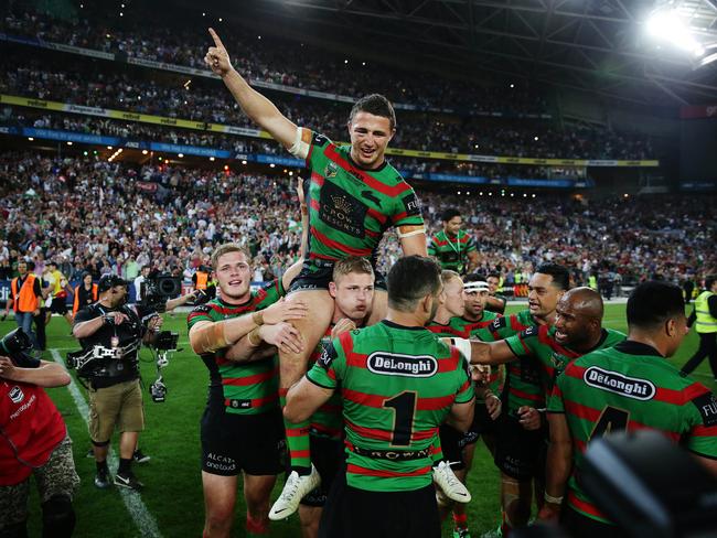 South Sydney's Sam Burgess celebrates the grand final victory at ANZ Stadium with his team mates last years. Picture: Brett Costello