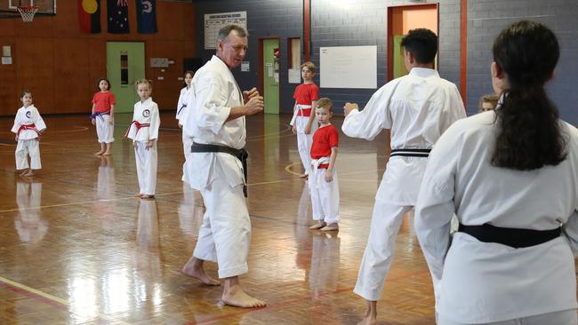 Fudoshin Shitoryu Karate classes have begun again at Cairns State High School, after a strict COVID Safe plan was implemented. Sensei Chris Long runs a drill for his students who are socially distanced. PICTURE: BRENDAN RADKE