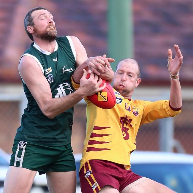 Echuca’s Kane Morris and Shepparton’s Ash Holland go head-to-head in the ruck in the grand final. Picture Yuri Kouzmin