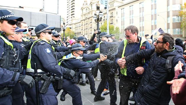 Police and protesters clash outside Parliament House in Melbourne during a COVID-19 lockdown protest on Mother’s Day. Picture: Stuart McEvoy/The Australian.