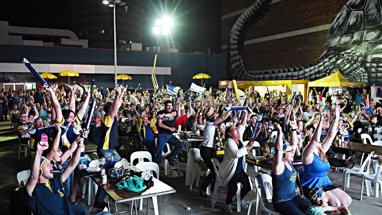 Cowboys fans watch the big game at the Cowboys Leagues Club car park party on Sturt Street, Townsville. Picture: Zak Simmonds