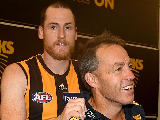 MELBOURNE, AUSTRALIA - MAY 05:  Jarryd Roughead and Alastair Clarkson of the Hawks celebrate winning the round seven AFL match between the Essendon Bombers and the Hawthorn Hawks at Melbourne Cricket Ground on May 5, 2018 in Melbourne, Australia.  (Photo by Quinn Rooney/Getty Images)