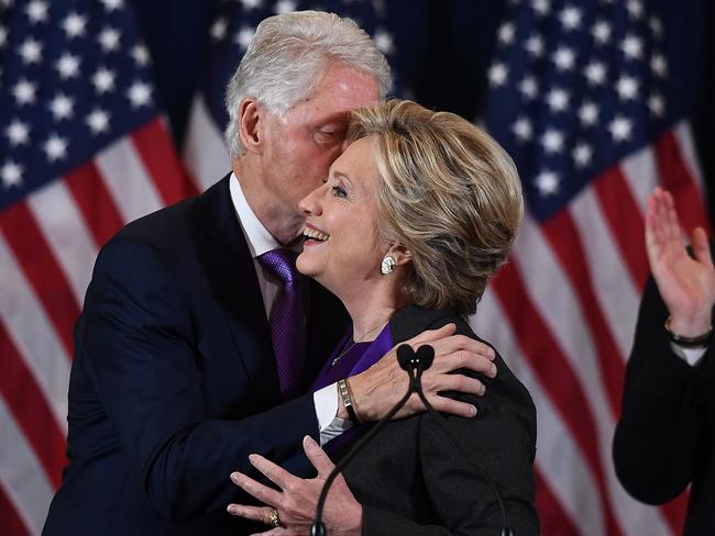 Hillary Clinton is embraced by husband and former president Billl Clinton after making her concession speech. Picture: AFP PHOTO / JEWEL SAMAD