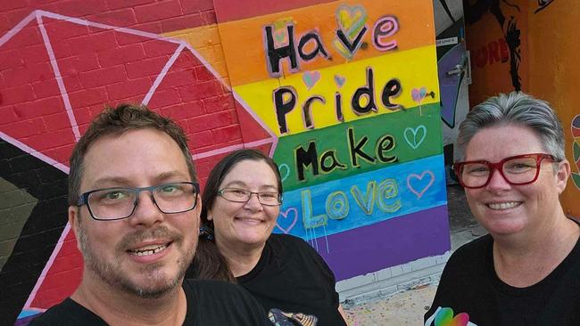 A rainbow flag mural on Austin lane was defaced during the Top End Pride march on Saturday June 24. Volunteers soon after painted over the homophobic slur.