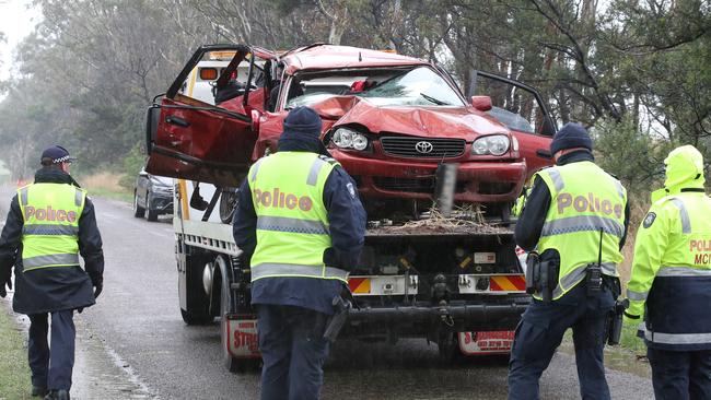 Police remove the crashed car at the Bochara crash scene where four people were killed. Picture: NCA NewsWire / David Crosling