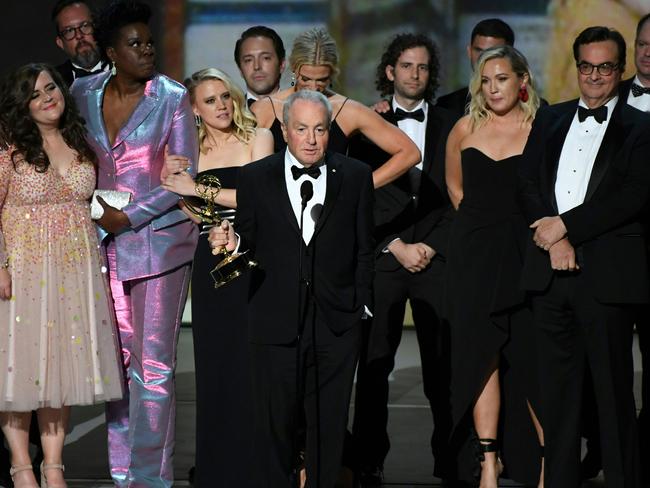 Emmy-winner Lorne Michaels, centre, the executive producer of SNL, with the cast and crew. Picture: AFP