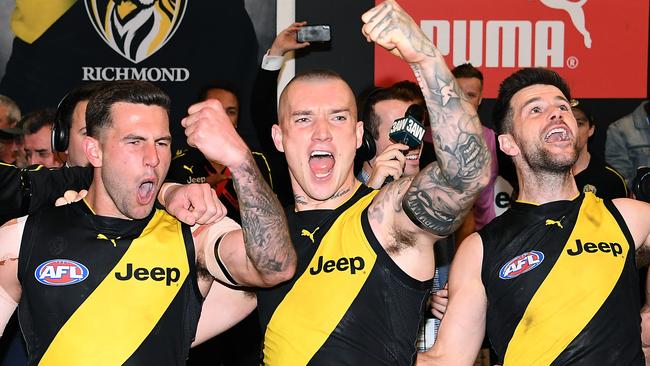 Jack Graham, Dustin Martin and Trent Cotchin in full voice. Picture: Getty Images