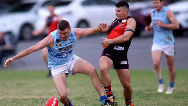 Sacred Heart Old Collegians Connor Hartshorneholds off Tea Tree Gully’s Samuel Bruhn during the Adelaide Footy League division two semi-final. Picture: Kelly Barnes