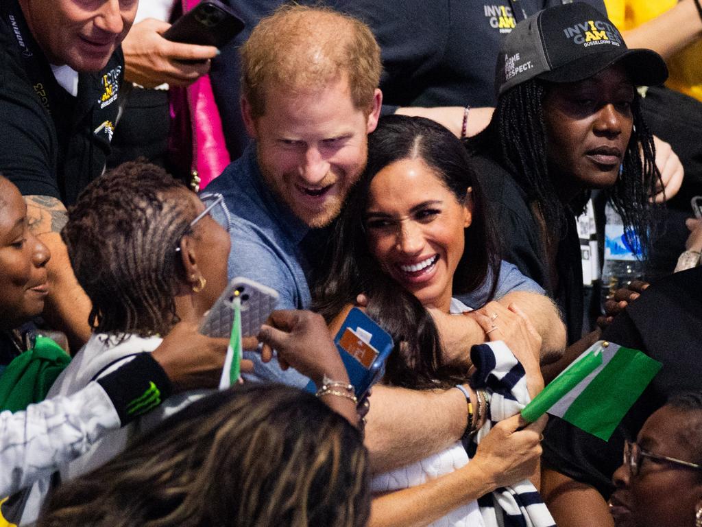 The pair smiled at fans as they kept cuddling. Picture: Rolf Vennenbernd/picture alliance via Getty Images