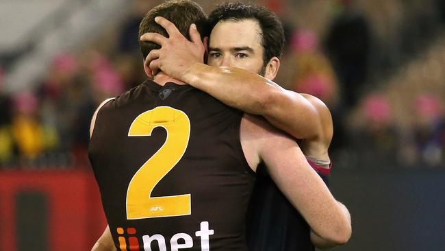 Jordan Lewis and Roughead embrace after a game. Picture: Wayne Ludbey