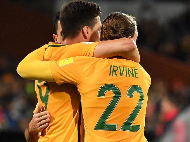 ADELAIDE, AUSTRALIA - JUNE 08: Tomi Juric and Jackson Irvine of Australia celebrate while a television are seen on the pitch during the 2018 FIFA World Cup Qualifier match between the Australian Socceroos and Saudi Arabia at the Adelaide Oval on June 8, 2017 in Adelaide, Australia.  (Photo by Daniel Kalisz/Getty Images)