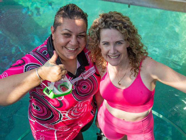 NT Breast Cancer Voice representative Natalie Stokes and Breast cancer survivor Belinda Kolstad entering the cage of death at the Crocosaurus Cove, Darwin. Picture: Pema Tamang Pakhrin