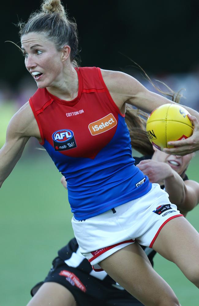 A super fit Mel Hickey breaks a tackle as she charges forward during Friday night’s practice match. Picture: Ian Currie