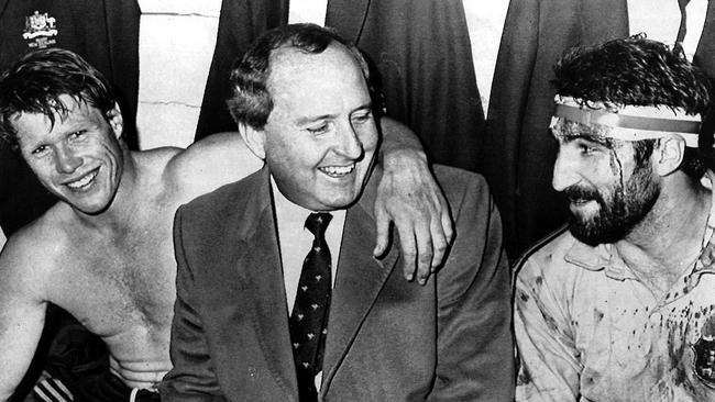 Wallabies coach Alan Jones flanked by captain Nick Farr-Jones (L) and Peter Grigg are all smiles after Australia defeated New Zealand's All Blacks in the first Bledisloe Cup test match in 1986.