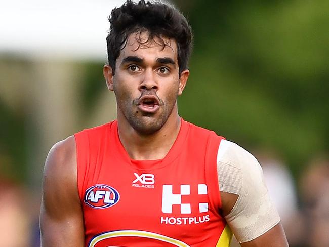 TOWNSVILLE, AUSTRALIA - MARCH 04:  Jack Martin of the Suns runs the ball during the AFL JLT Community Series match between the Geelong Cats and the Gold Coast Suns at  Riverway Stadium on March 4, 2018 in Townsville, Australia.  (Photo by Ian Hitchcock/Getty Images)