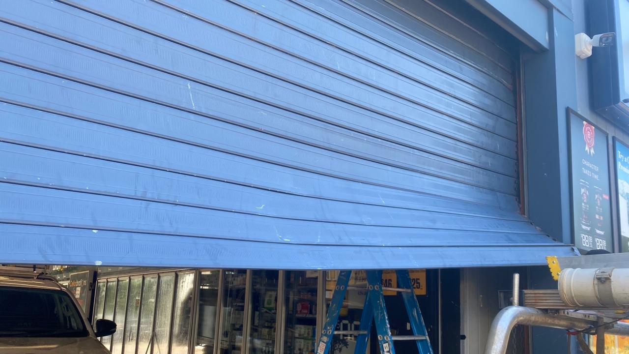 Some damage of the roller door at Frontier bottle shop after a ram raid on the premise.