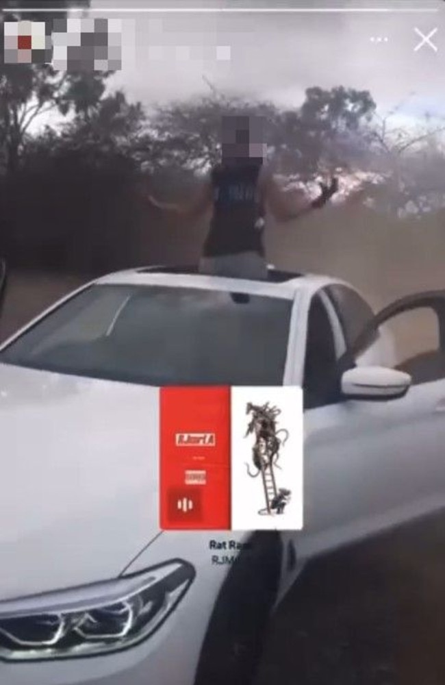 A young car thief in a Instagram Story standing through the sunroof of Sera Shin's BMW after it was stolen and driven around Townsville at high speeds.