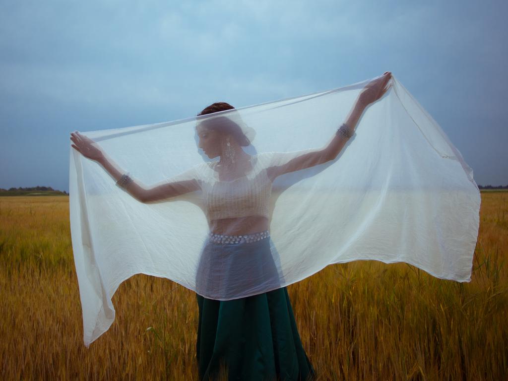Image Name: Nisha in a cornfield Photographer Name: Mirella Lukens Year: 2018. Commended, Open Culture, and Winner, Netherlands National Award. Picture: Sony World Photography Awards/ Mirella Lukens
