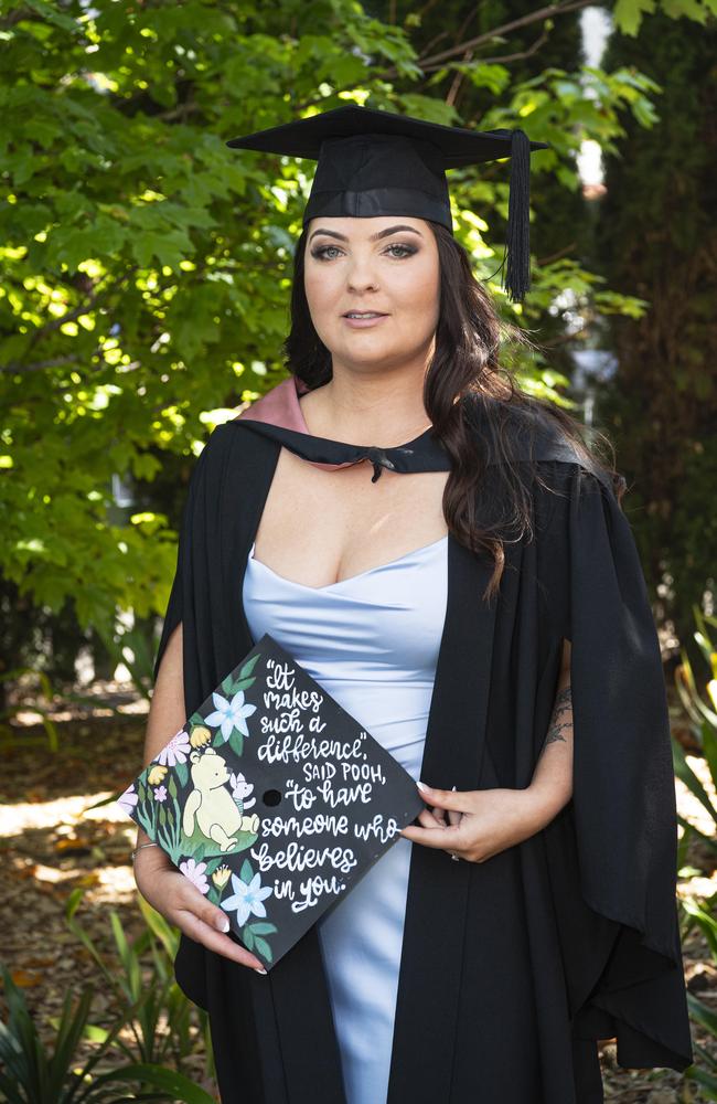 Bachelor of Education (Primary) graduate Kristin Wells with a painting she made to celebrate her mum at a UniSQ graduation ceremony at The Empire, Tuesday, October 29, 2024. Picture: Kevin Farmer