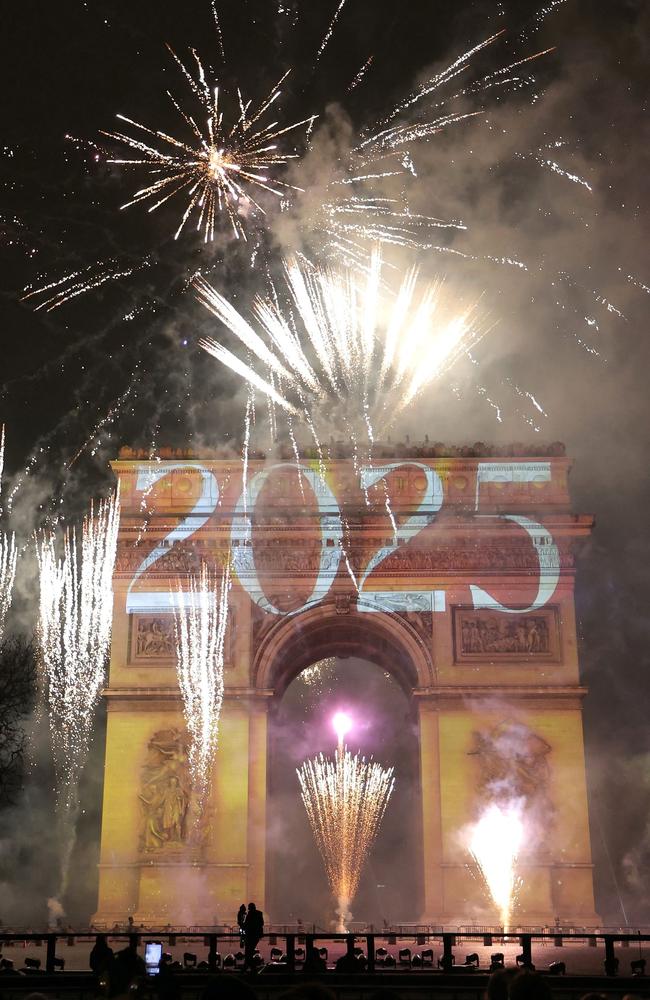 Fireworks illuminate the sky around the Arc de Triomphe. Picture: Getty