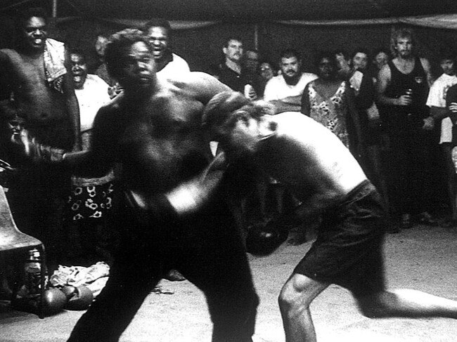 Jimmy Sharman's touring stars show in Sideshow Alley. The Sharman Troupe would tour urban and regional shows in search of the next champion boxer, many of them Aboriginal, who would go on to be some of the biggest names in Australia.